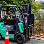 A student drives a forklift.