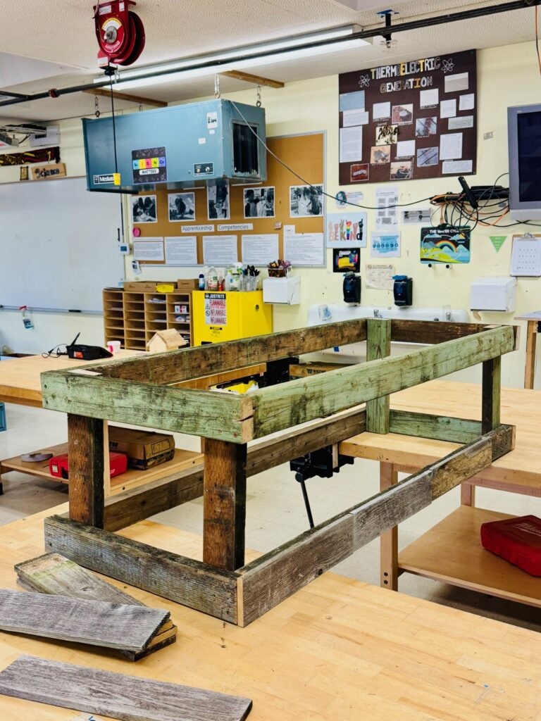 flower bed made from reclaimed wood with frame built out