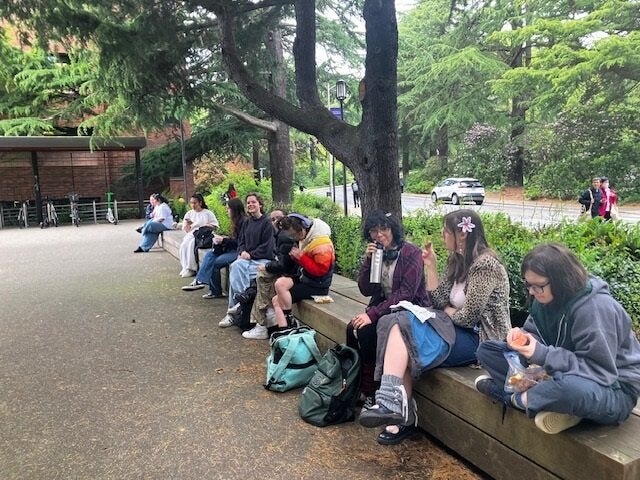 students resting in UW botanical garden