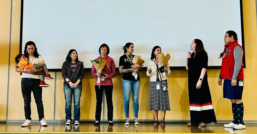 Photo of people receiving gifts of flowers