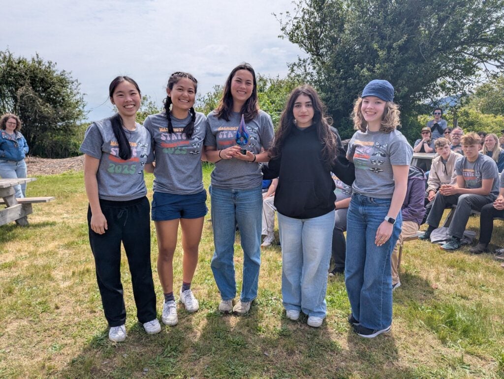 Group of students standing in field