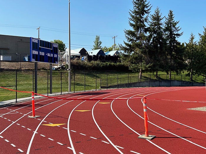 a portion of an 8-lane running track
