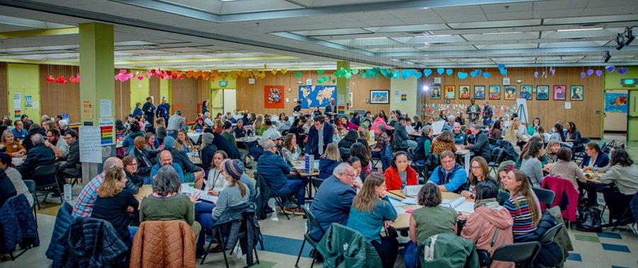 Large group of people at a Superintendent community meeting in the Salmon Bay Cafeteria