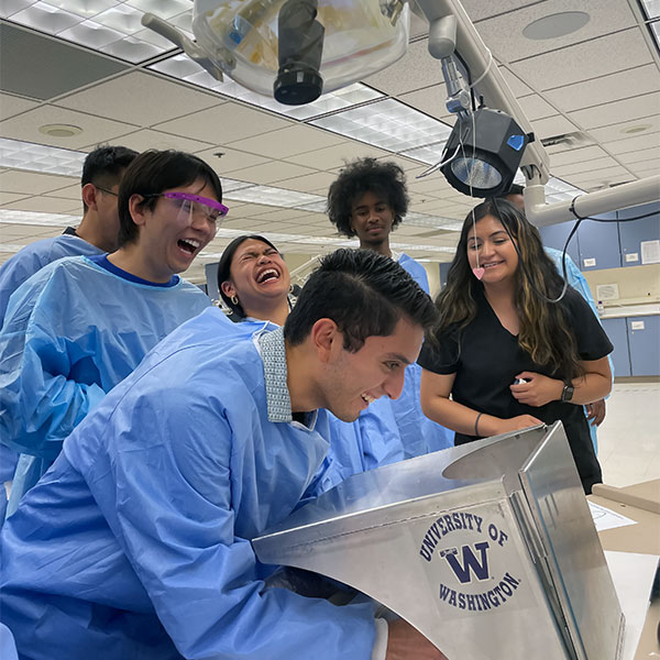 Students laughing while studying dentistry at UW