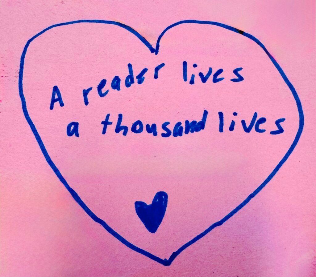 Student artwork saying "a reader lives a thousand lives"