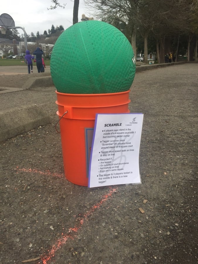 scramble ball sittting in a bucket with scramble rules