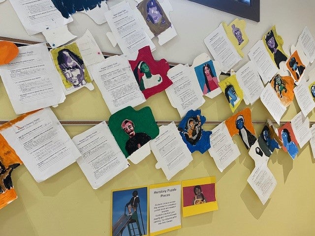 Hallway of Herstory Puzzle Pieces Students chose a woman they admired to complete a portrait study and research template. Students practiced grid-drawing and monochromatic painting. Our influence artist was Amy Sherald.
