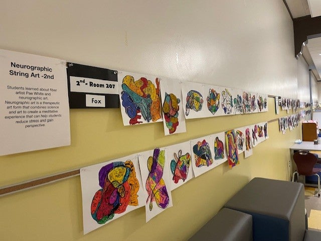 hallway view of art pieces abstract shape with colored shapes inside
