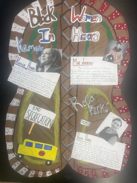 mixed media on shield shape with text related to BLM