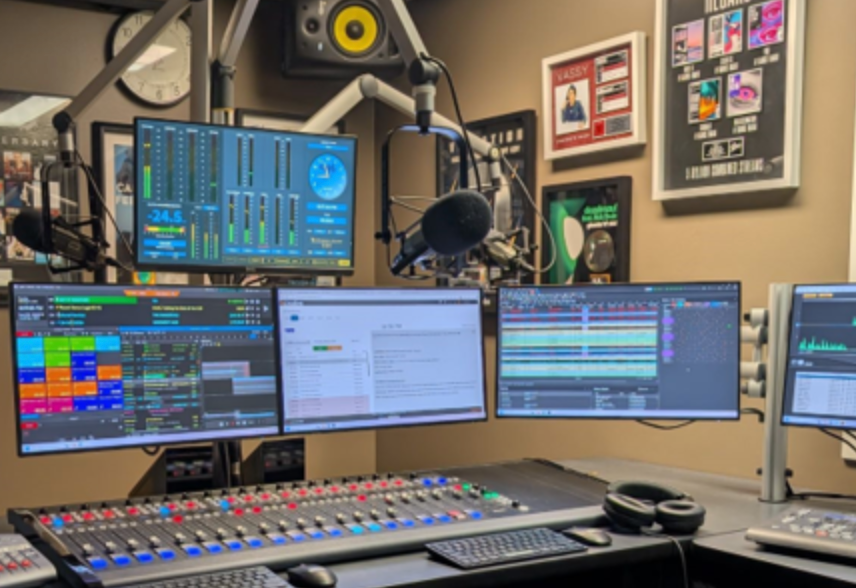 Radio Station room at NHHS with computer screens.