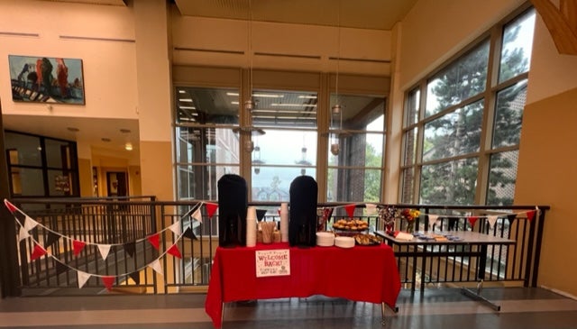 Tables in the hallway welcoming back staff with lunch items.