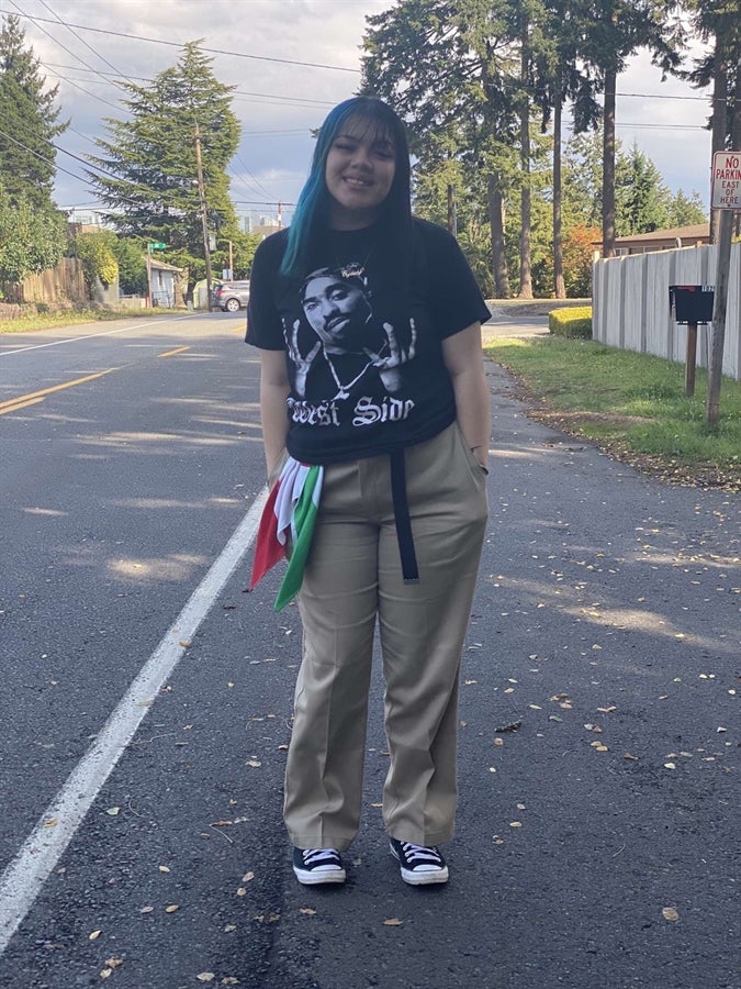 Photo of student on side of street