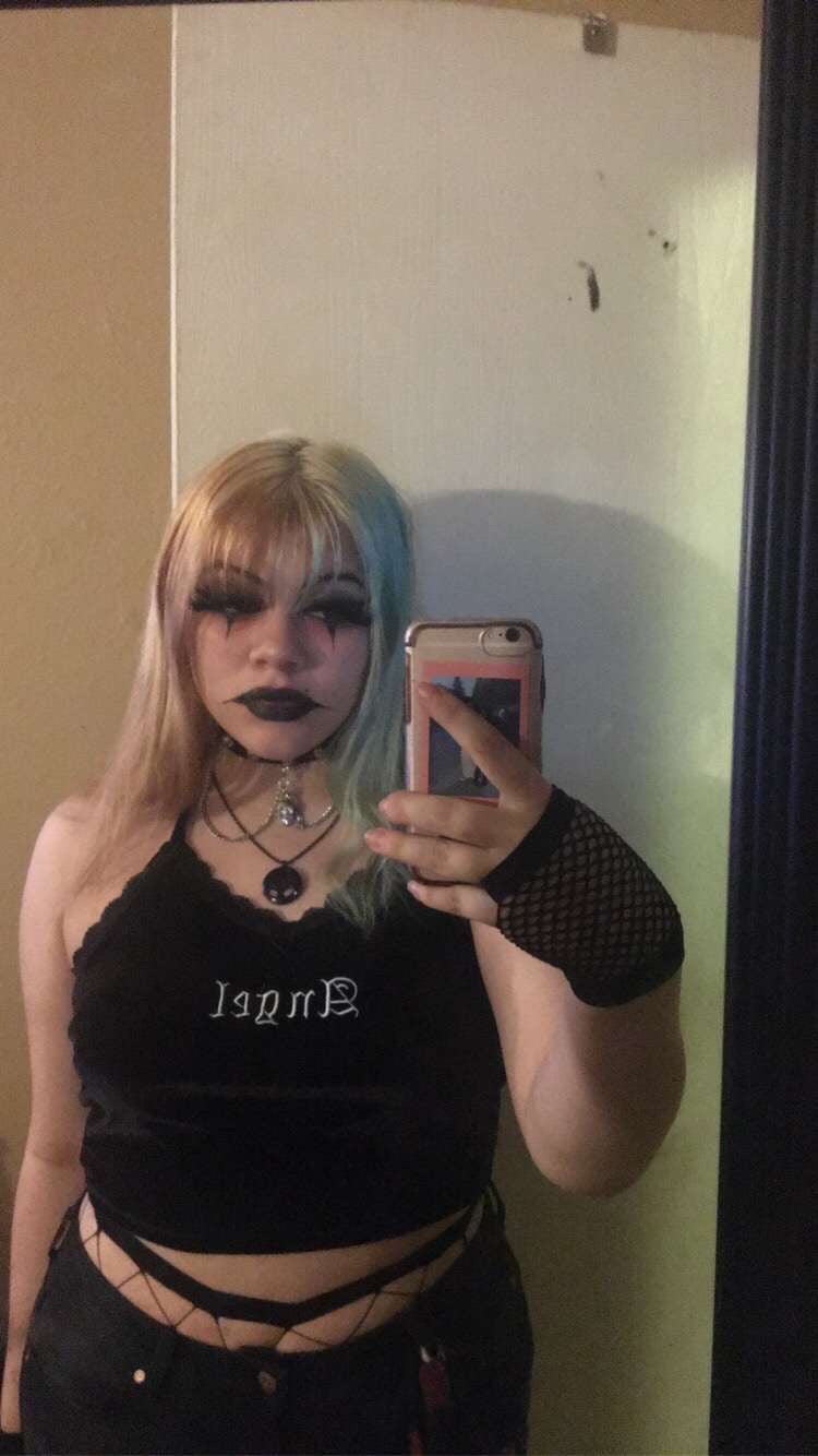 Photo of student looking in mirror