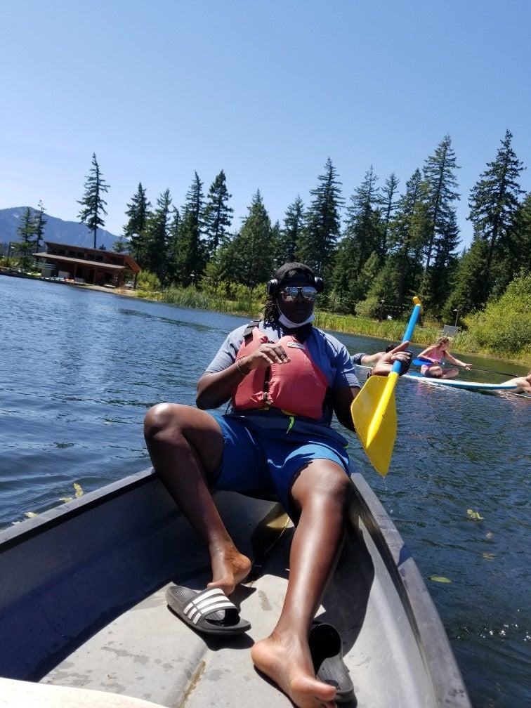 Photo of teacher sitting in boat