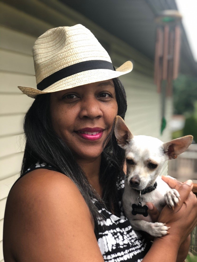 Photo of teacher holding dog
