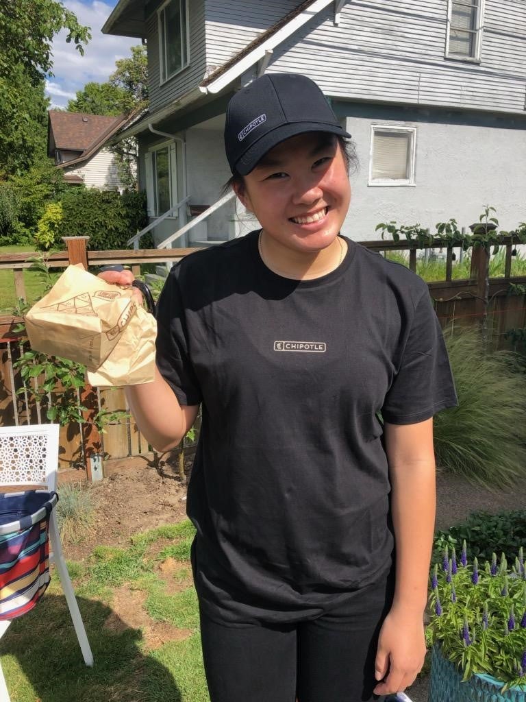Photo of student holding bag of chips