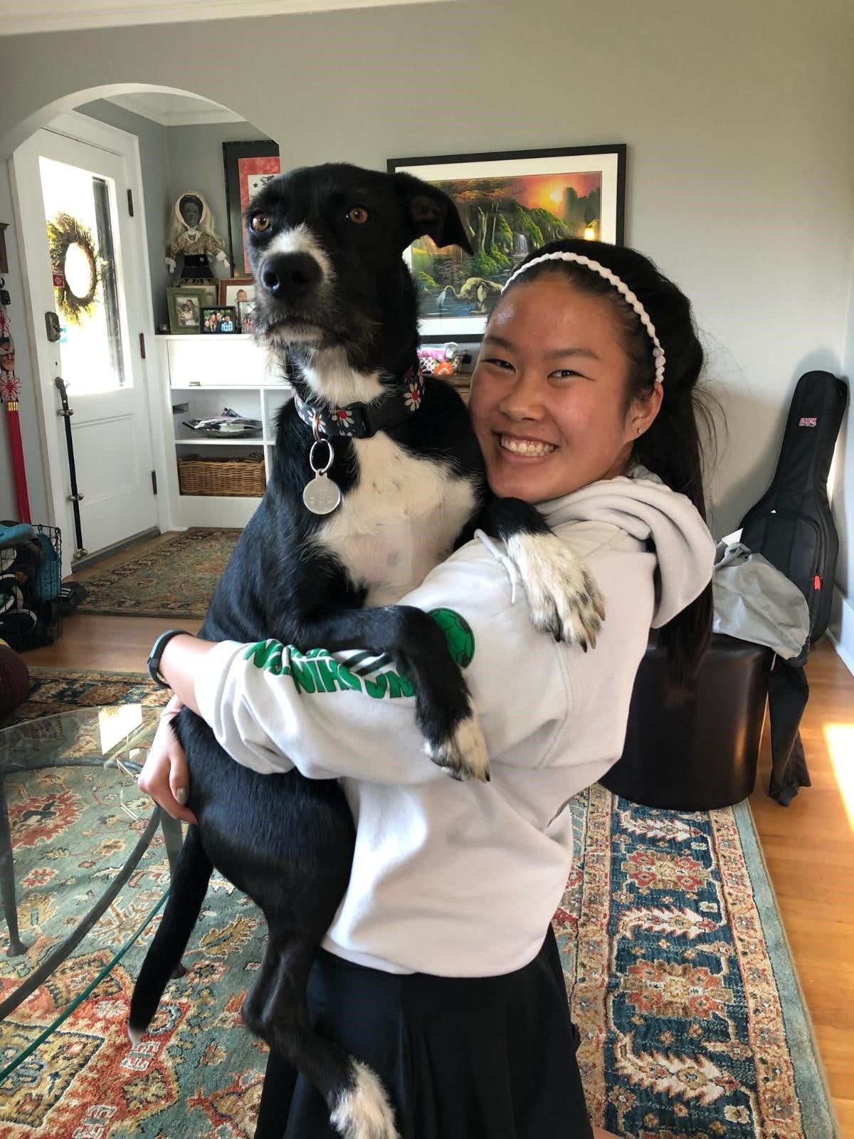 Photo of student holding a dog