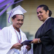 Graduate getting diploma