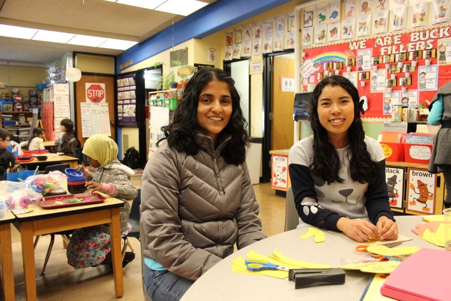 Reny Mathan (left) and Melissa Bean volunteer weekly at James Baldwin Elementary as tutors and classroom helpers in Mrs. Mulder’s Kindergarten Classroom.