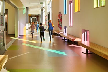 Students in walk down a school hallway