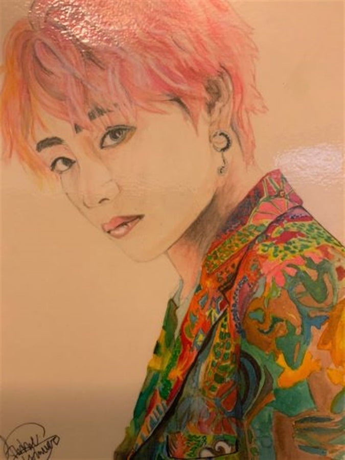 A drawing in pencil of a young person