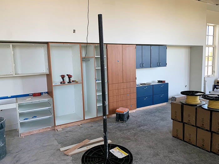 a room with cabinets being installed
