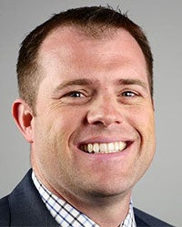 Michael McCarthy smiles for a photo