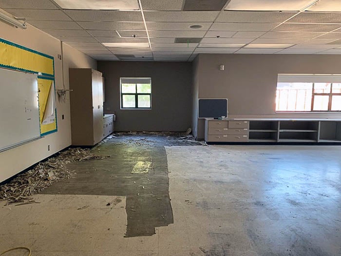 a classroom with flooring removed