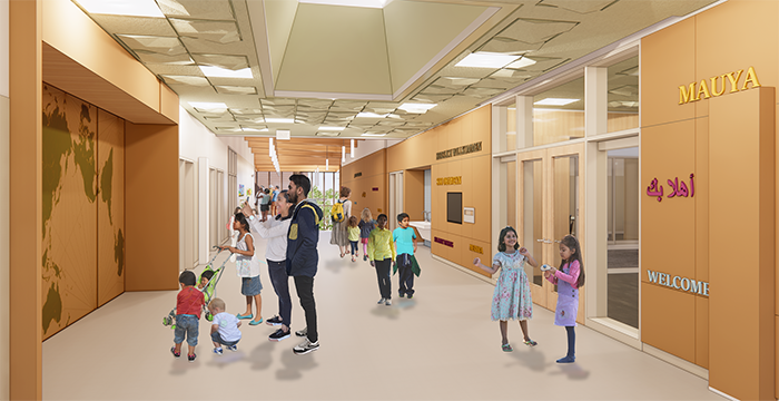 a hallway with people looking a map and going through glass doors