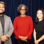 Three school board members pose for a photo.