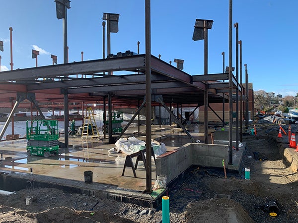 a building under construction with structural steel going up