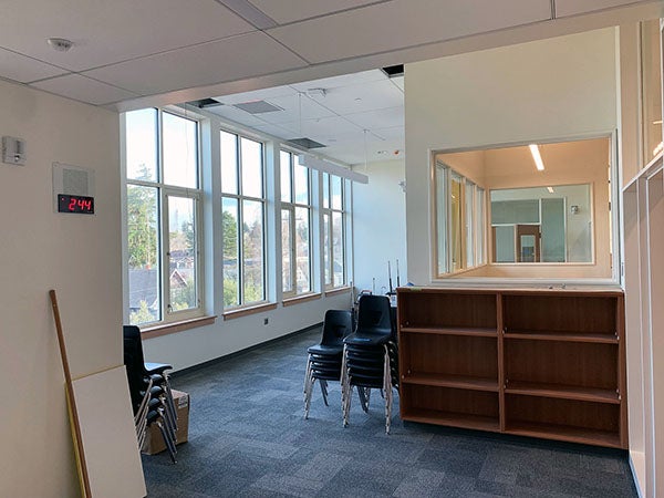 a space with windows and doors to classroom