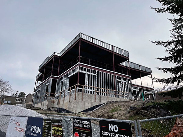 a view looking up at a 2 story building under construction