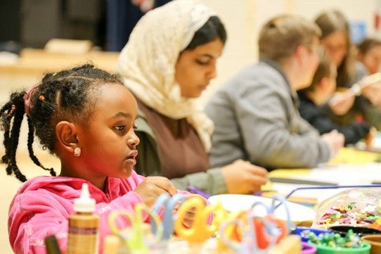 students working on a project at a table