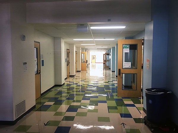 a hallway with doors opening off of it