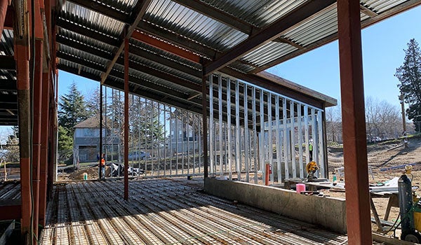 a partially constructed building with no walls and some metal studs