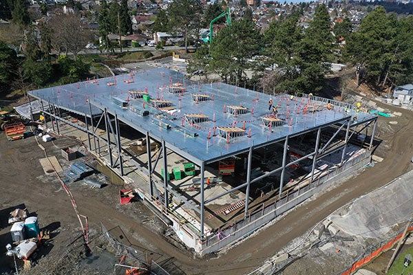 aerial view - metal roof material on top of a structural steel frame with wood lined rectangle holes