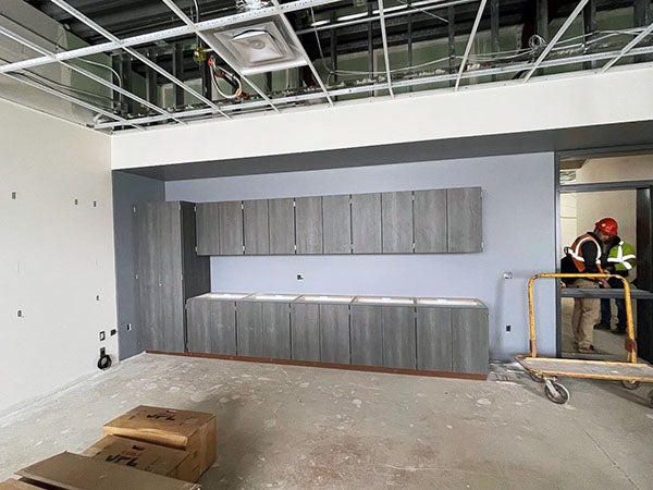 cabinets in a large unfinished room