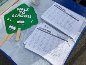 Walk to school signs and calendars where students can track their trips for prizes