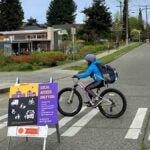 Kids biking into school on School Street at Genesee Hill Elementary