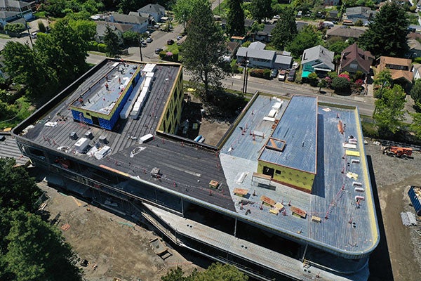 the roof of a building with roofing materials