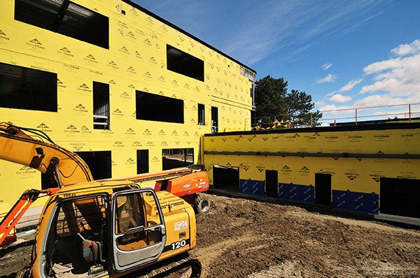 Exterior of a building under construction. it is yellow