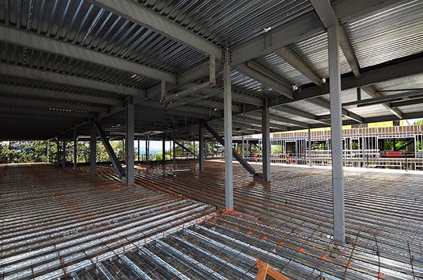 interior of a building under construction with metal and rebar on the floor