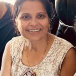 Photo of Manju Sharma wearing a tan and beige print sleeveless top