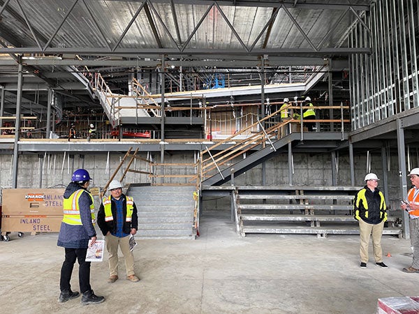 a partially completed stair way with bleachers next to it