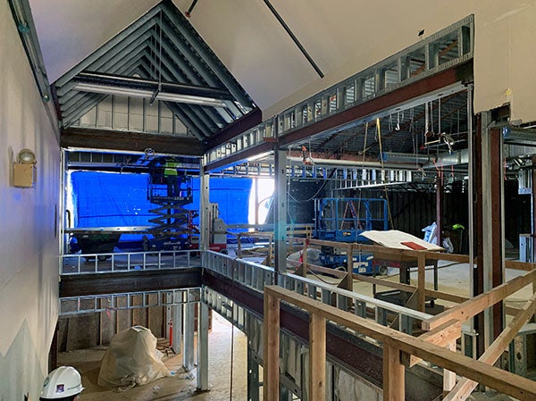 interior of a building under construction with a peaked ceiling