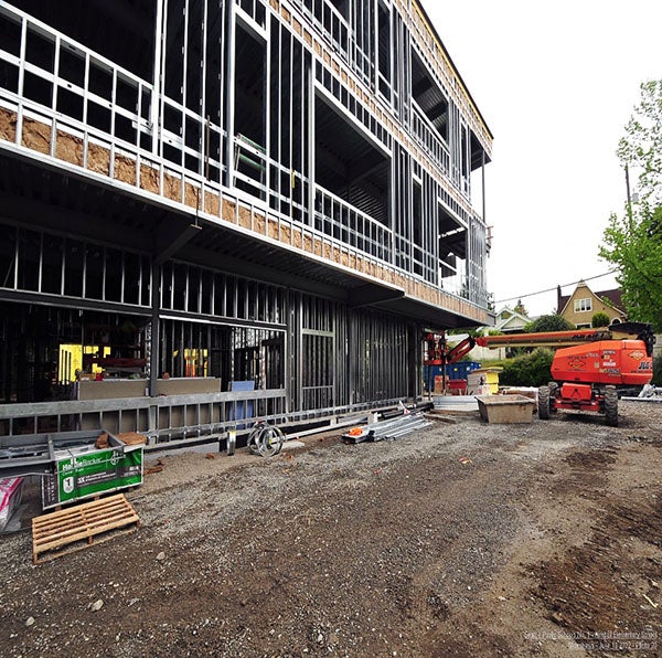 a building under construction with metal wall studs