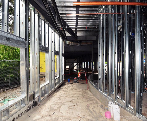 interior of a building under construction with metal studs making a curved shape