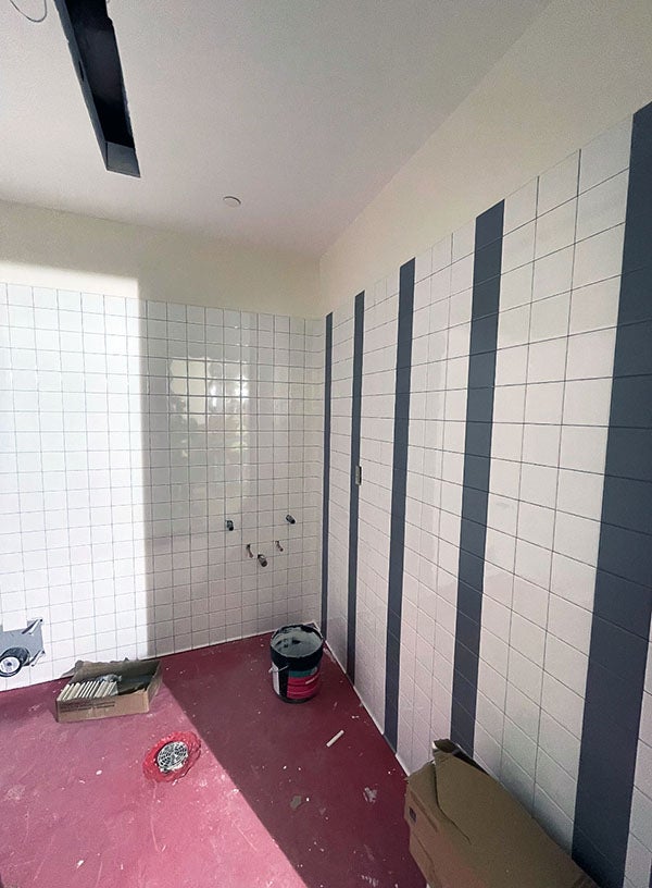 white tile wall with gray tile stripes