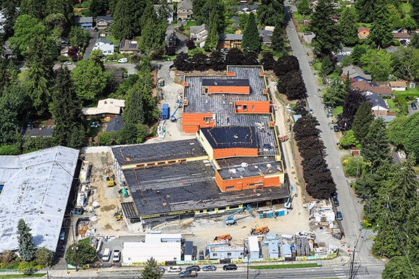aerial view of a large building with construction happening